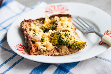 vegan pizza pie with broccoli, mushrooms and chickpeas dough wit