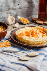 Homemade hummus of chickpeas, tahini paste and with paprika,rust