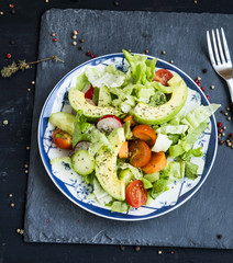 Healthy avocado and vegetables salad with radish,onions,lettuce