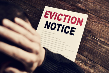 young man who has received an eviction notice - obrazy, fototapety, plakaty