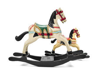 old toy horses on a white background