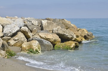 Fototapeta na wymiar Rocks on sea, Marbella, Spain