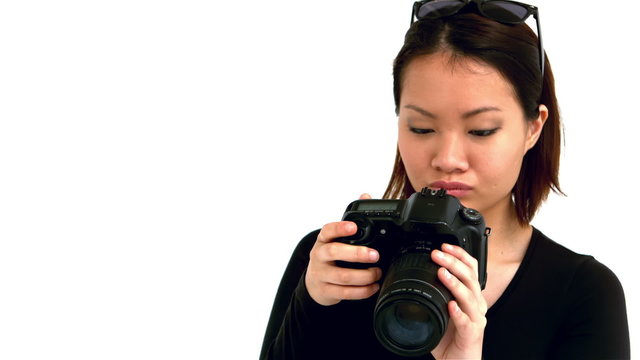 Asian woman using professional camera