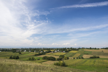 Fototapeta na wymiar Village on summer fields