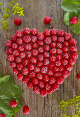 Heart shaped cake with raspberries 