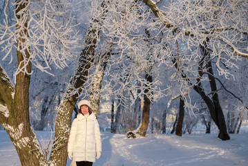 Beautiful woman 50 years old walking on the snowy city of St. Petersburg