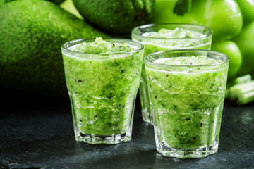 Fresh green detox smoothie made from apples, avocados, greens, l