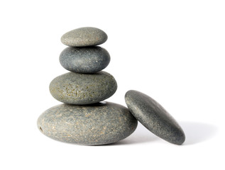 Pyramid made of Icelandic pebbles on white background
