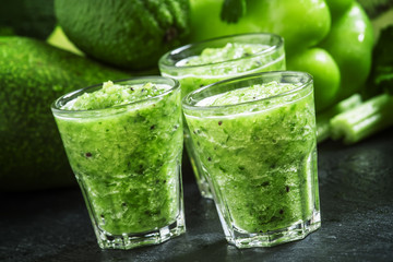 Fresh green detox smoothie made from apples, avocados, greens, l