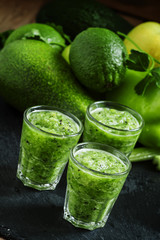 Fresh green detox smoothie made from apples, avocados, greens, l
