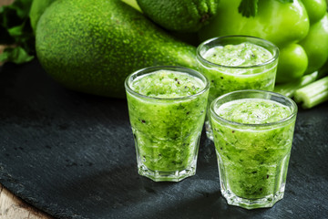 Fresh green detox smoothie made from apples, avocados, greens, l