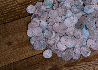 Fototapeta na wymiar trove of ancient medieval coins silver background