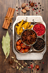 Assorted spices and spicy in silver bowls. Top view