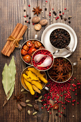 Assorted spices and spicy in silver bowls. Top view