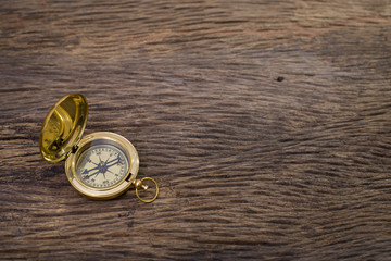 Old Compass on wood background