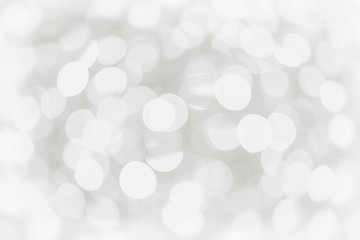 Defocused white lights during winter evening in city