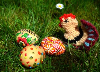Easter Eggs with little fowl on a green grass