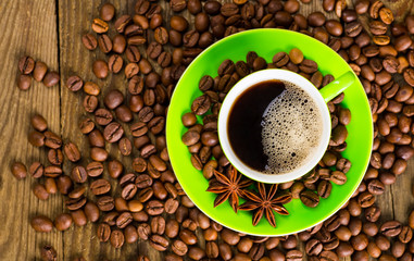 Coffee and coffee bean on wood background