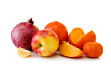 Pomegranate and fruits isolated on the white .