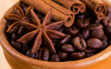 of coffee with coffee beans and cinnamon sticks