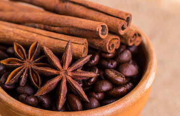 of coffee with coffee beans and cinnamon sticks