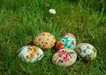 Colorful painted easter eggs on a green grass