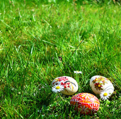 Colorful painted easter eggs on a green grass