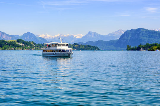 Cruise ship in front of Alps mountains peaks on Lake Lucerne, Switzerland