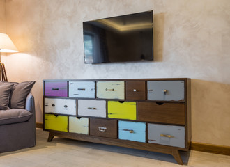Shabby chic style commode in modern home interior