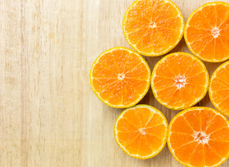 Slice fresh orange fruit  on wood background with copy space