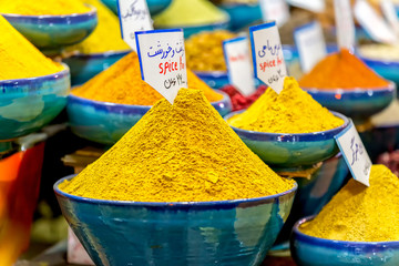 Exposed spices with prices in the store on the Vakil Bazaar in the Shiraz city centre, Iran.