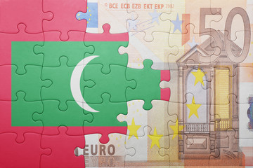 puzzle with the national flag of maldives and euro banknote