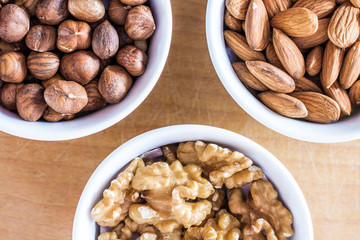 Three bowls of assorted nuts