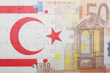 puzzle with the national flag of colombia and euro banknote