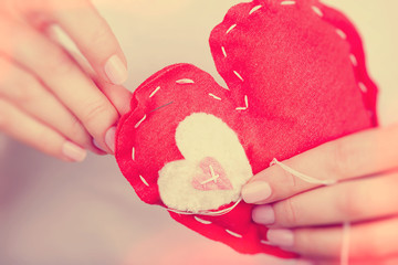 Sewn red heart toy