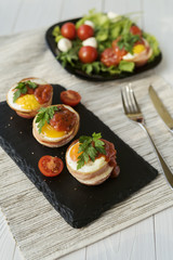 Fried eggs with cheese and bacon