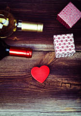 Red Wooden Heart, Bottles Of Wine, Gift Boxes And On Wooden Board. Love Concept. Valentines Day Background.