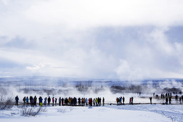 Tourists at the famous geyser Strokkur, Iceland