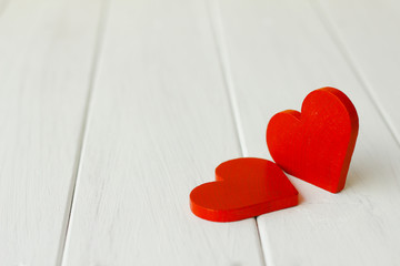 Fototapeta premium Stock Photo:.Two Wooden hearts on a wooden background