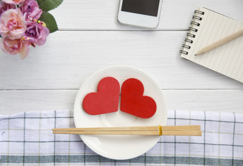 Stock Photo:. Red heart on plate on wooden background