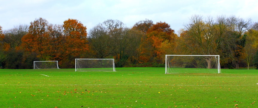 Panoramic image of football playground with three goalposts