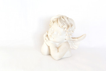 Figurine of angel on white background