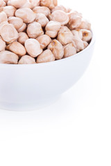 Raw dry chickpeas in bowl on white background