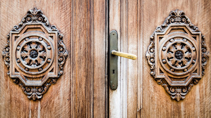 Detail of an ancient wooden door carved.