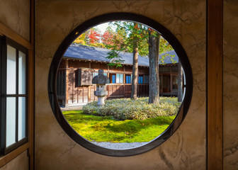 View of a Japanese Garden Through a Round Window