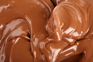 Background of melted milk chocolate, close-up