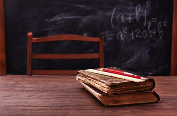 Books and school accessories on wooden table