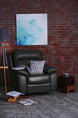 Leather armchair and floor lamp in living room