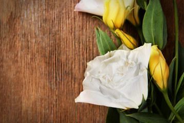 Beautiful white flowers on wooden background, copy space