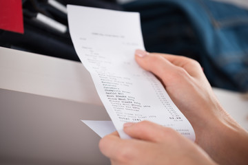 Fototapeta premium Woman Holding Receipt In Store